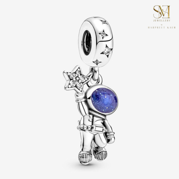 Explore the wonders of the cosmos with our exquisite Astronaut Charm, crafted in sterling silver and adorned with sparkling blue stones—a perfect piece for dreamers and stargazers alike.